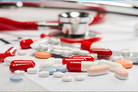 Pills on Table for Medicare Advantage Open Enrollment