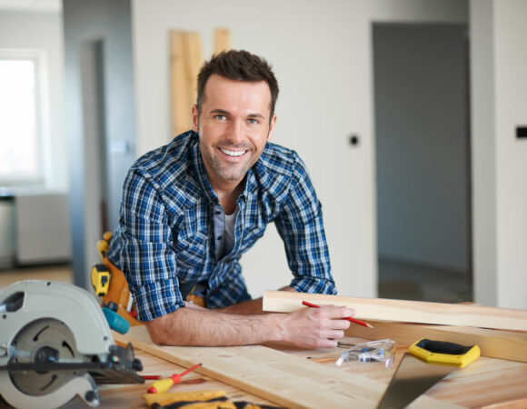 a professional contractor smiling because they have Contractors Insurance in Columbus, Madison, North Vernon, Seymour, IN, and the Surrounding Areas