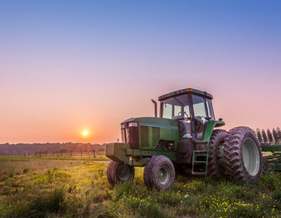 tractor during sunset with Agriculture Insurance in Greensburg, IN, Versailles, IN, Scottsburg, IN, Columbus, IN, Seymour, IN, North Vernon, IN and Nearby Cities