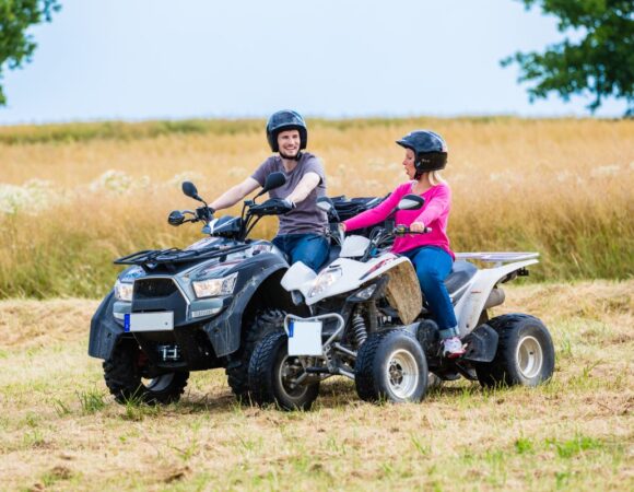 Couple Riding ATVs with ATV Insurance in Seymour, IN
