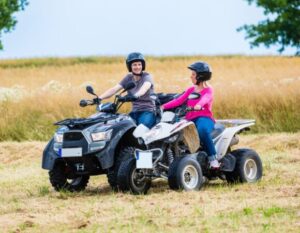 Father and Daughter on ATVs with ATV Insurance in Greensburg, IN