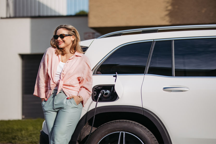 Smiling Woman in Madison, IN Getting Gas for a Car with Auto Insurance