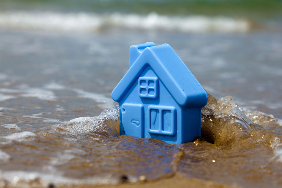 Home Figurine on Beach for Homeowners Insurance in Madison, IN