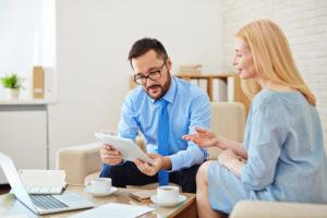 Insurance agent reviewing worker's compensation insurance coverage options in Madison, IN