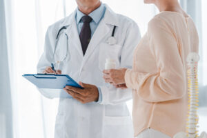 woman and doctor discussing Life Insurance Plans in Columbus, IN